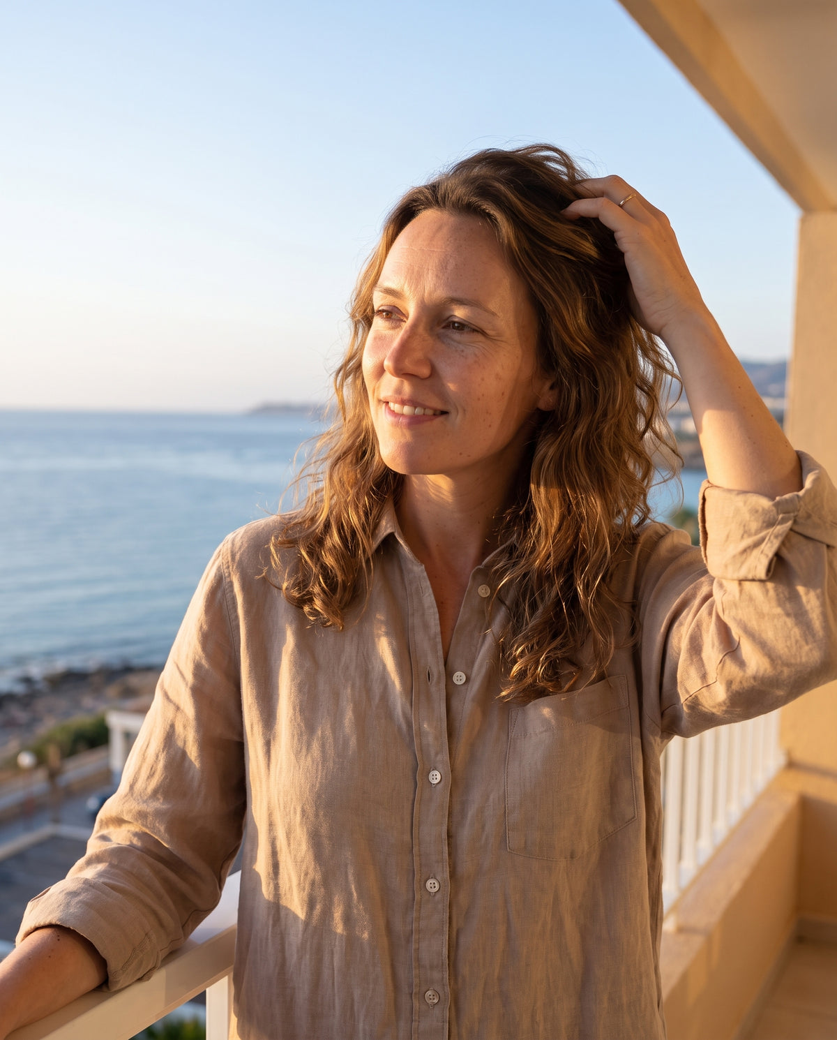 Soft, air-dried hair on a morning balcony